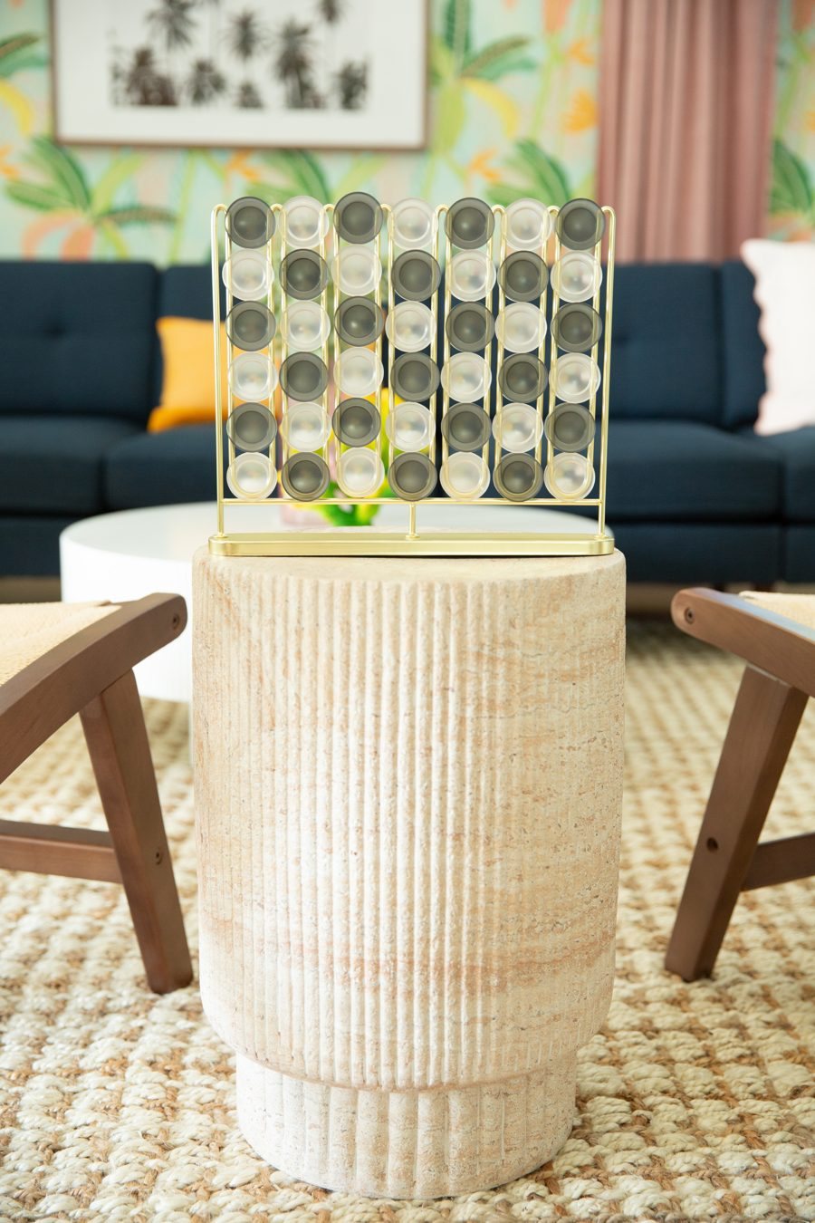 Gold Connect 4 game on a stone side table in the living room